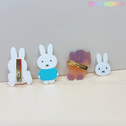 Four Kawaii Bunny & Bear Acrylic Hair Clips from Tiny Mochi are shown on a light surface, with pastel logo accents. Two display cute animal fronts and two show metal clasps, perfect cute hair accessories for girls and women.