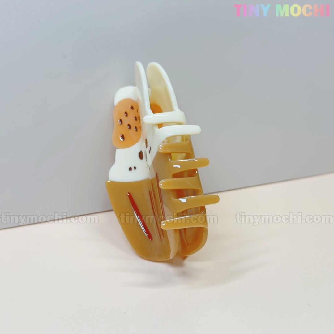 The Tiny Mochi Kawaii Cupcake Bunny Hair Claw Clip features a cute strawberry dessert design in acrylic, perfect for women and girls. This adorable accessory is shown against a plain light background.