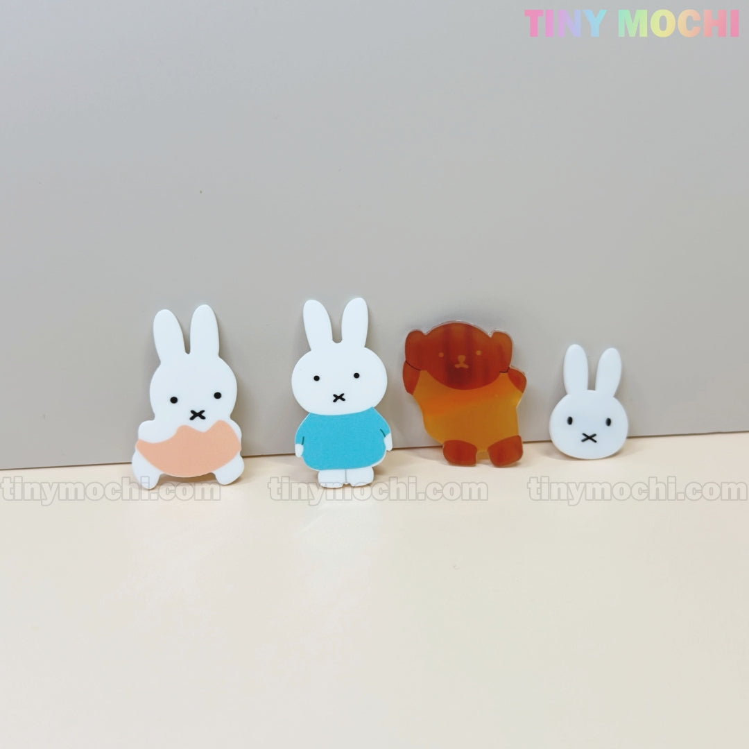 Four Kawaii Bunny & Bear Acrylic Hair Clips by Tiny Mochi, featuring three white rabbits in various outfits and a brown bear, are displayed upright on a light background. Pastel Tiny Mochi text appears above these cute animal accessories for girls and women.