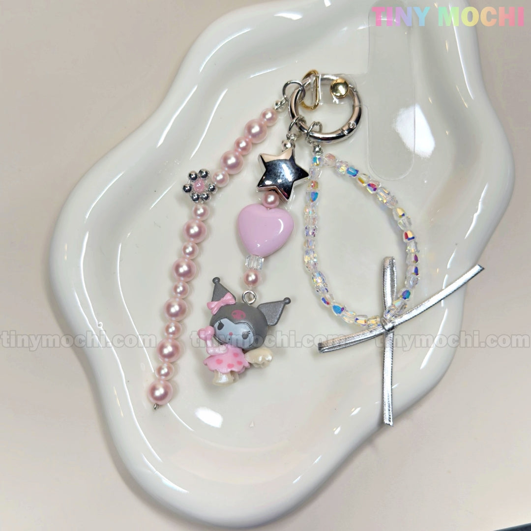 The Tiny Mochi Kawaii Angel Charm Keychain Kit is a DIY set with pastel pink beads, silver star, pink heart, and a cute gray elephant charm—perfect for making a Sanrio-inspired pearl, ribbon & star accessory for your phone, bag, or keyring.
