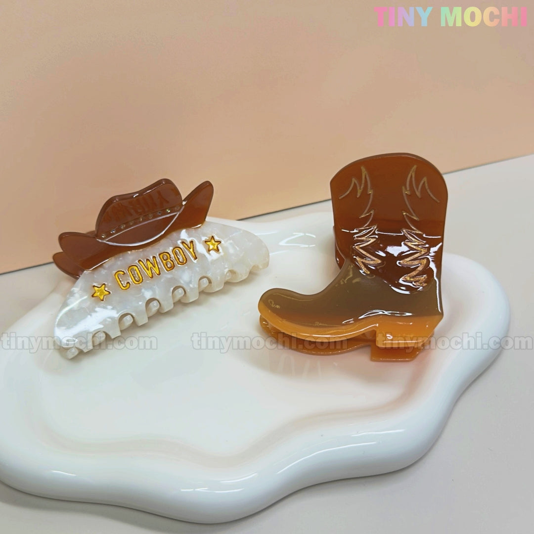 Add Western flair to your look with Tiny Mochis Western Cowboy Hair Claw Clips—cute cowgirl barrettes featuring a boot and COWBOY hat design, perfect for women and girls who love trendy accessories.