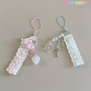Set of two Tiny Mochi Kawaii Pastel Lace Ribbon Keychains—one pink with heart and bead charms, one blue with star, heart, and key charms. Cute fairycore bag charm accessories—perfect for adding a touch of whimsy!.