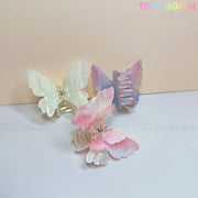 The NEW UV Color-Changing Butterfly Hair Claw Clip by Tiny Mochi features a double layer acetate design in pastel shades, adding a magical spring Fairycore Aesthetic to any look. Transform your style with this enchanting hair accessory.