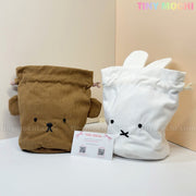 The Kawaii Bunny & Bear Drawstring Pouch – Corduroy Coin Makeup Bag by My Store features a brown bear and a white bunny pouch, each with cute faces and ears, displayed side by side in front of a business card on a light background.