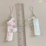 Two Tiny Mochi Kawaii Pastel Lace Ribbon Keychains—Heart & Star Bag Charms in pink and blue—are shown by a clear ruler measuring about 11 cm. These cute fairycore accessories stand out against a light background.