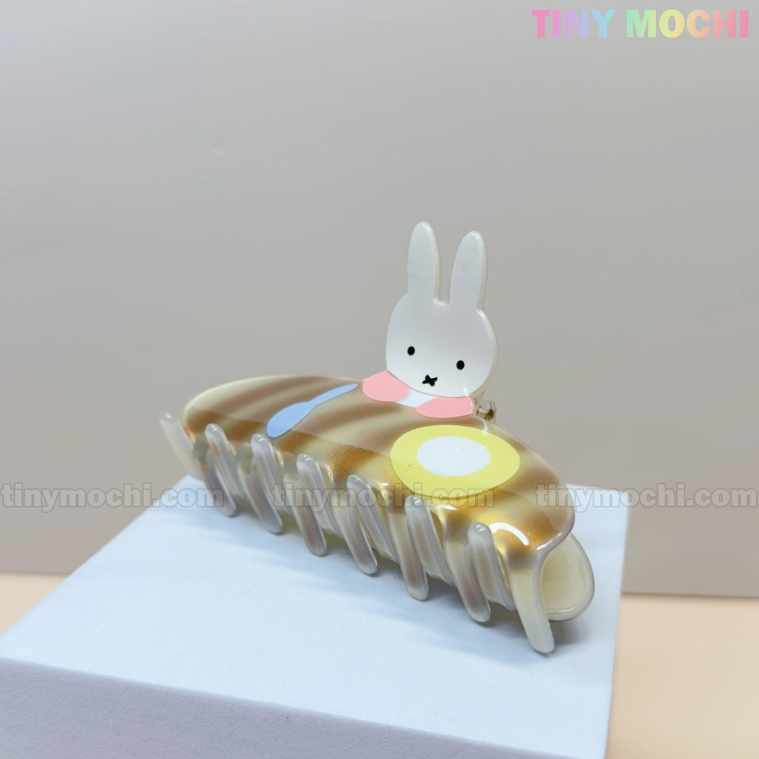 The Kawaii Bunny Breakfast Hair Claw Clip by Tiny Mochi features a cute bunny with pancakes and eggs, displayed on a white and beige background as an adorable acrylic hair accessory for women and girls.