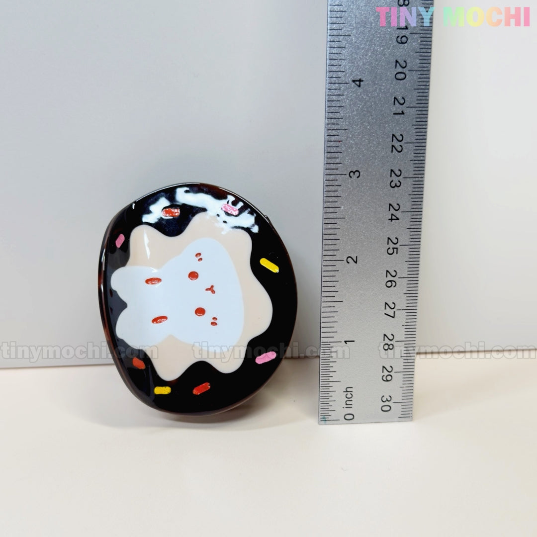 The Tiny Mochi Kawaii Bunny Hair Claw Clip features a cute donut sprinkle or croissant design in durable acrylic and measures about 5 cm tall. Shown next to a ruler for size, its ideal for fans of adorable kawaii accessories.