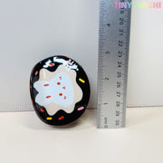 The Tiny Mochi Kawaii Bunny Hair Claw Clip features a cute donut sprinkle or croissant design in durable acrylic and measures about 5 cm tall. Shown next to a ruler for size, its ideal for fans of adorable kawaii accessories.