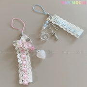 The Tiny Mochi Kawaii Pastel Lace Ribbon Keychain – Heart & Star Bag Charm features handmade charms with lace, ribbons, beads, and pastel accents—perfect fairycore accessories in pink with hearts or blue with a star and key.
