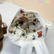 The Kawaii Bunny & Bear Drawstring Pouch from My Store is a white corduroy coin makeup bag with an open top, lined with cute animal and plant prints. The words TINY MOCHI appear in pastel colors in the upper right corner.