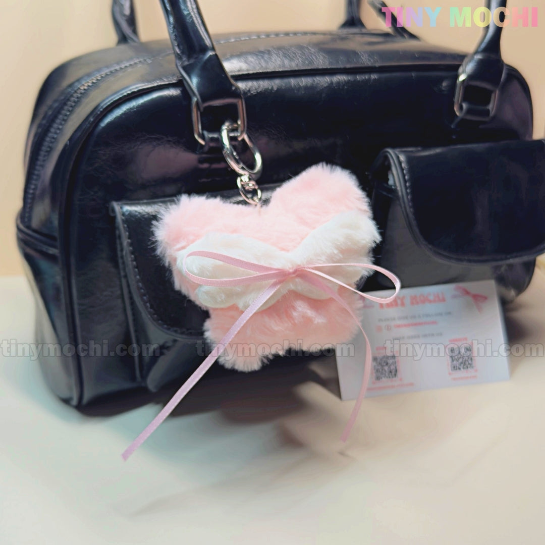 Add a touch of coquette style to your look with Tiny Mochi’s Plush Butterfly Bow Keychain—this pink fuzzy bag charm is the perfect cute gift and soft girl purse accessory to elevate your kawaii collection.