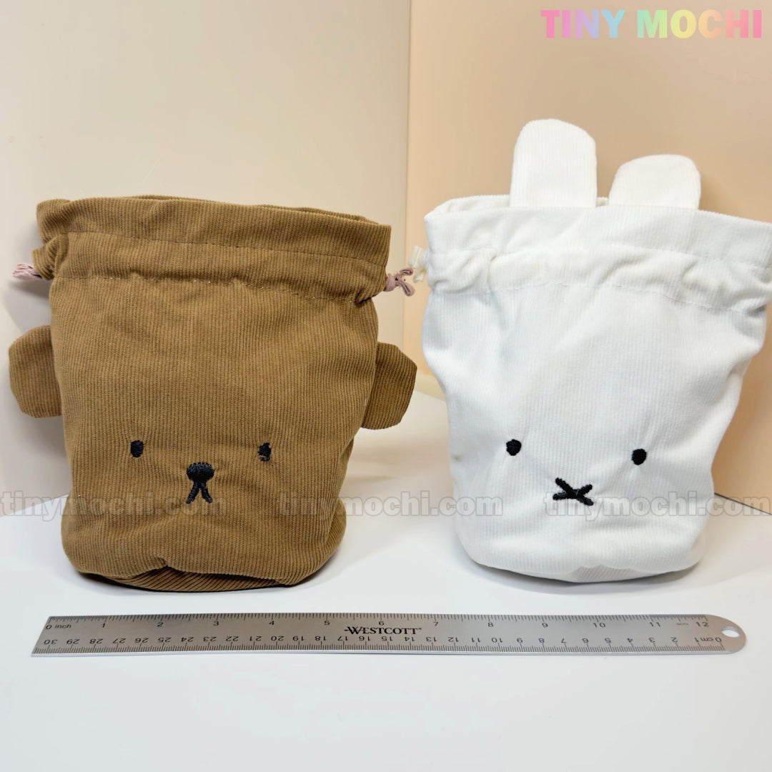 Two Kawaii Bunny & Bear Drawstring Pouches by My Store, made of corduroy, stand side by side on a light surface with a ruler in front. Each cute coin/makeup bag features adorable details for added charm.