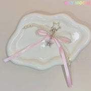 The Tiny Mochi Pink Star Bow Charm Keychain features a kawaii Y2K ribbon, pearl beads, and a dangling silver star—perfect as a phone charm or coquette bag accessory gift for your cute collection.
