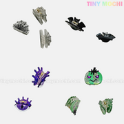 Kawaii Halloween Mini Claw Clips—spooky-cute hair accessories from Tiny Mochi Gift Shop Houston—feature bat, spider web, spider, and green pumpkin designs on a white background with the pastel Tiny Mochi logo in the top right.