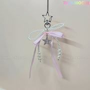 The Pink Star Bow Charm Keychain by Tiny Mochi features a star-shaped clip, pink ribbon, pearl beads, and a Y2K-inspired Twinkle Star Bow charm. Displayed on a pale background with TINY MOCHI in the top right corner.