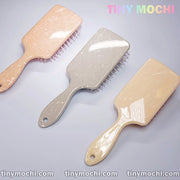 Nordic Style Paddle Brushes in Peach, Grey Blue, and Pink with Marble Pattern - Front View