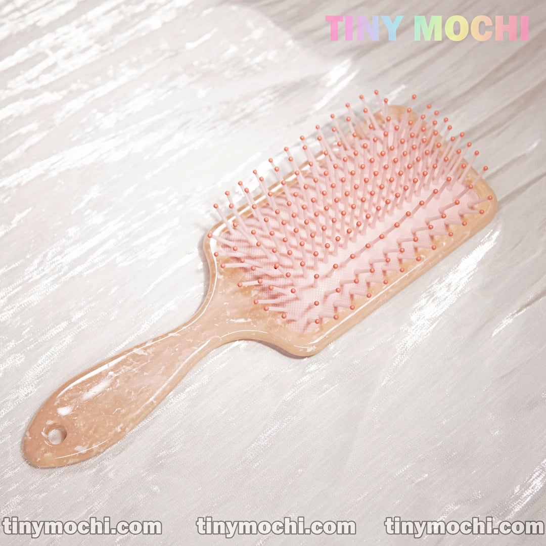 Pink Marble Pattern Paddle Hair Brush - Close-Up of Round-Tipped Bristles and Ventilated Cushion