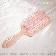 Pink Marble Pattern Paddle Hair Brush - Close-Up of Round-Tipped Bristles and Ventilated Cushion