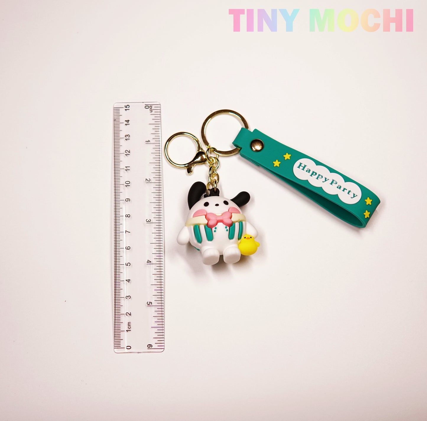Tiny Mochi’s Cute Kawaii Character Keychains feature a 3D anime-inspired dog with a cupcake, yellow chick, Happy Party tag, and clear 15cm ruler—an adorable gift for bag or key accessorizing! Perfect for fans of unique kawaii collectibles.