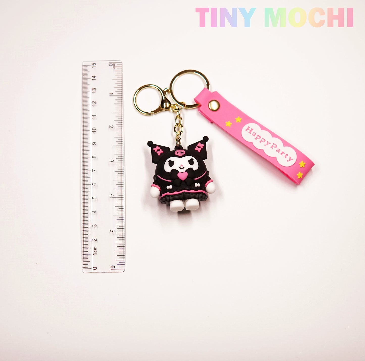 A Cute Kawaii Character Keychain by Tiny Mochi is shown with a clear ruler for scale on a white background. This adorable 3D anime-inspired keychain with strap is perfect for bags, keys, or as a unique gift. TINY MOCHI appears in pastel at the top right.
