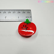A cute red tomato hair clip with a green top and smiling face from Tiny Mochi Gift Shop Houston is shown beside a ruler (about 3 cm wide) on a white background. Part of the Kawaii Vegetable Hair Clip Set – 8 Pieces.