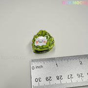 A Kawaii Vegetable Hair Clip Set (8 pcs) from Tiny Mochi Gift Shop Houston sits by a cm ruler. Perfect for fans of cute hair accessories, keychains, and bag charms. The pastel Tiny Mochi logo is visible above.